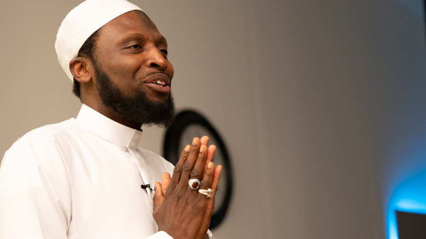 Sheikh Nuru, in a white clerical outfit